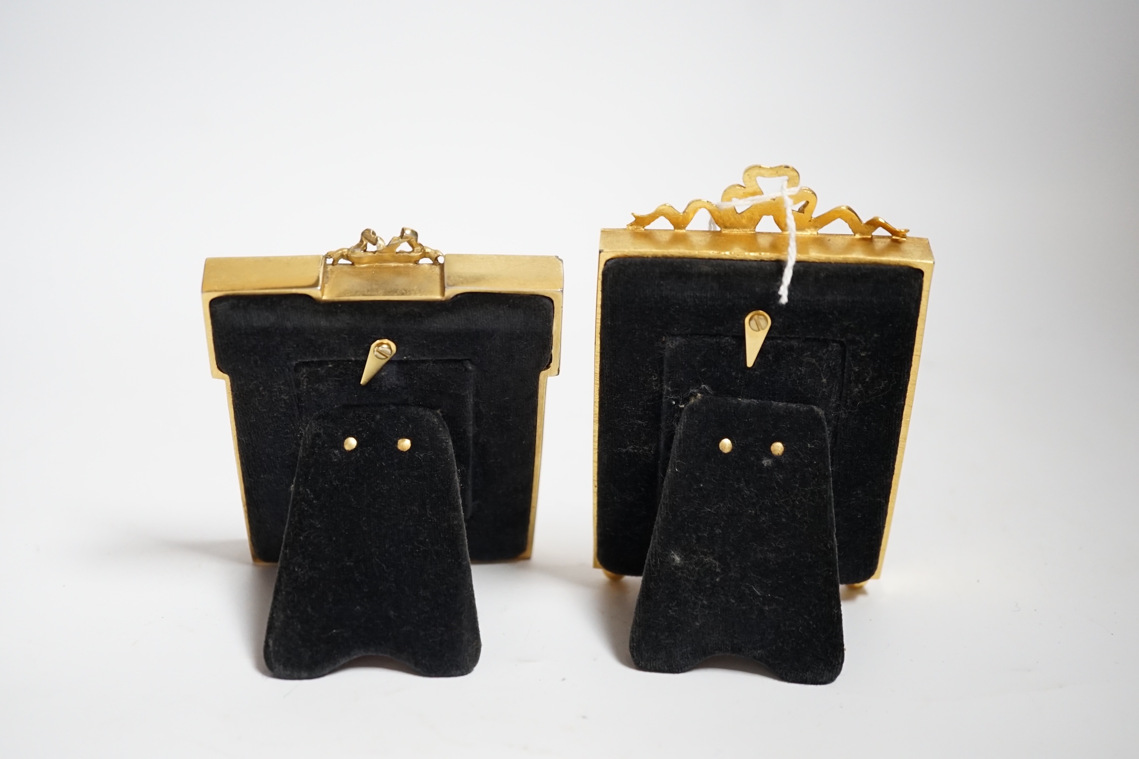 Two gilt metal and enamel miniature frames with fitted cases, largest 11cm high